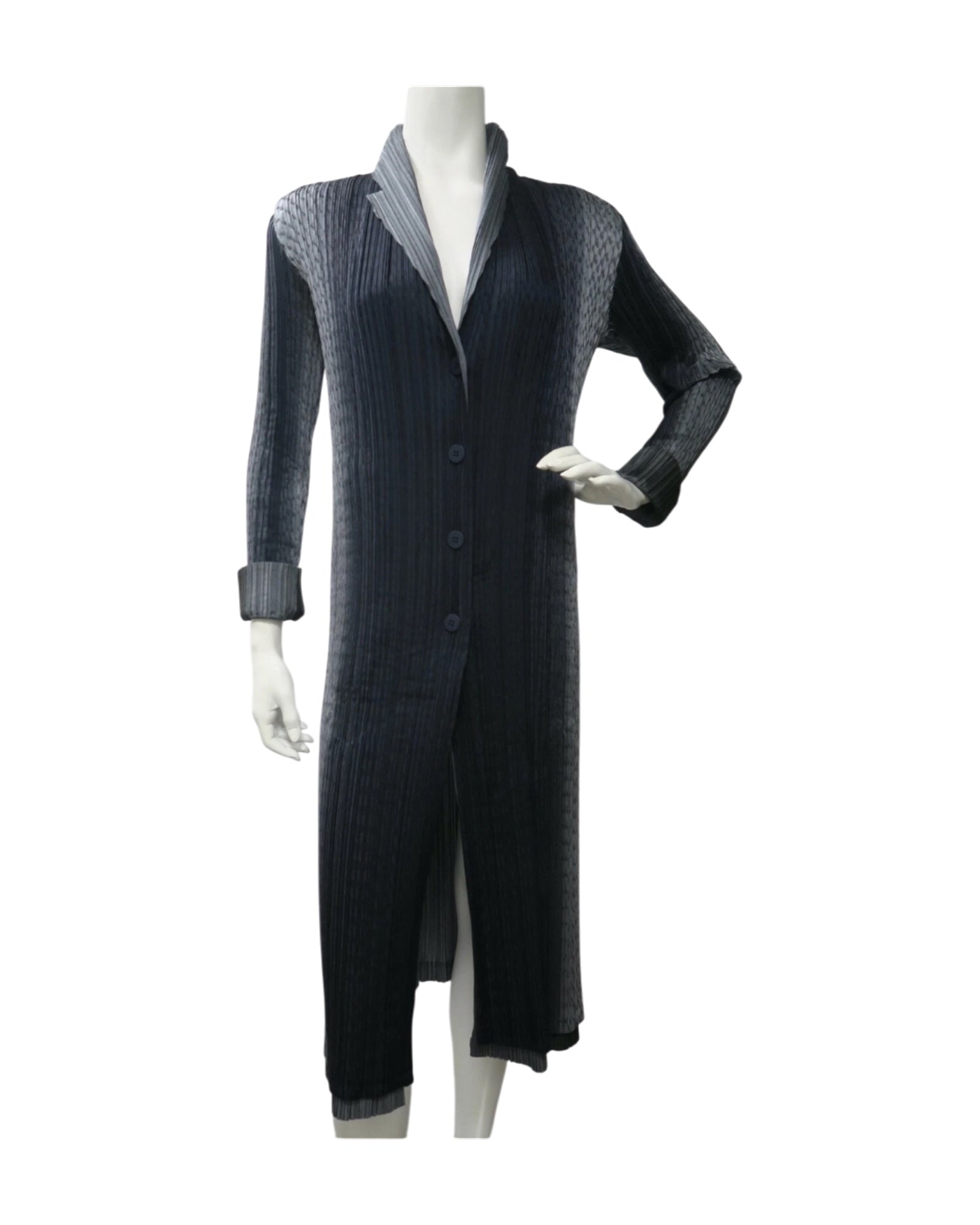 Issey Miyake Pleats Please reversible long pleated coat in gray charcoal and black with notched lapel and button-front closure.