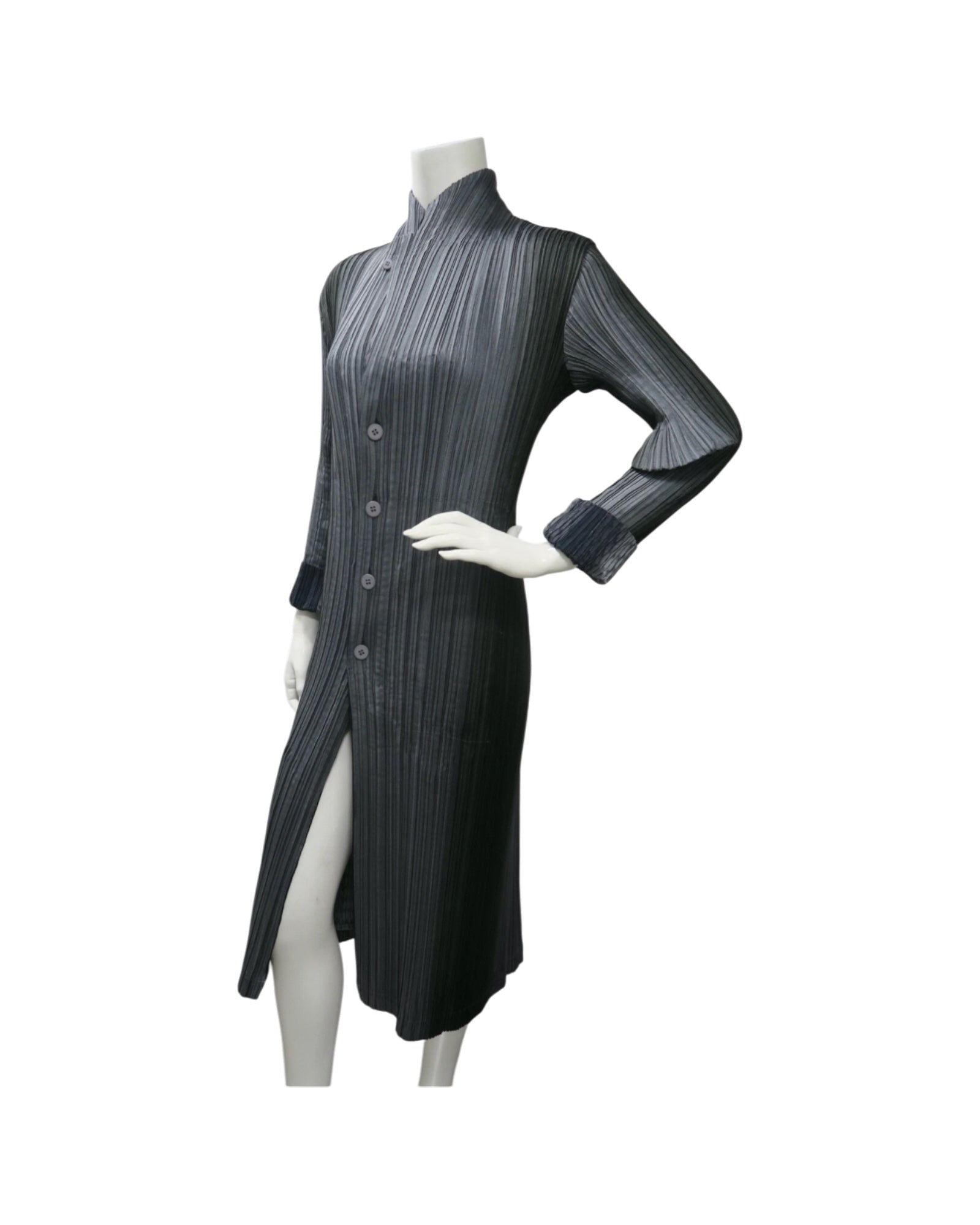 Issey Miyake Pleats Please reversible long pleated coat in gray charcoal and black with notched lapel and button-front closure.